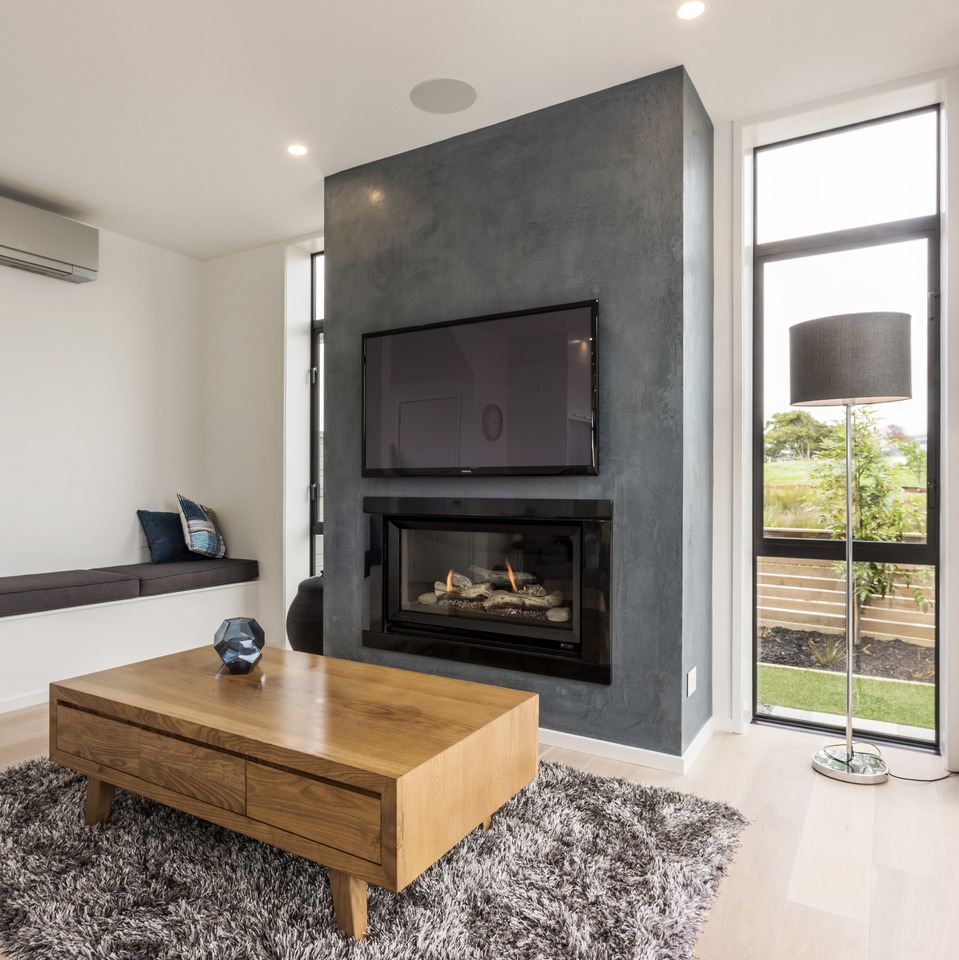 Gas fire in lounge with rug and coffee table
