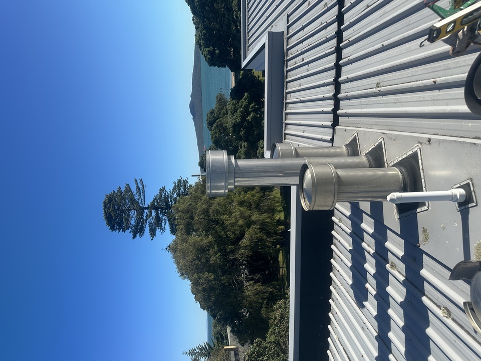 Copper pipe on roof top of commercial shops