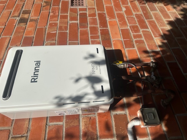 Rinnai gas hot water unit on brick house