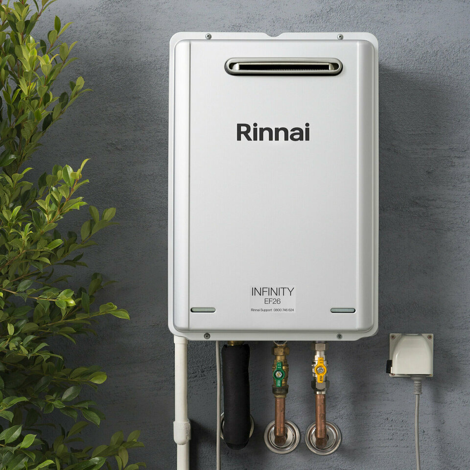 Close up Rinnai Infinity on house with plants