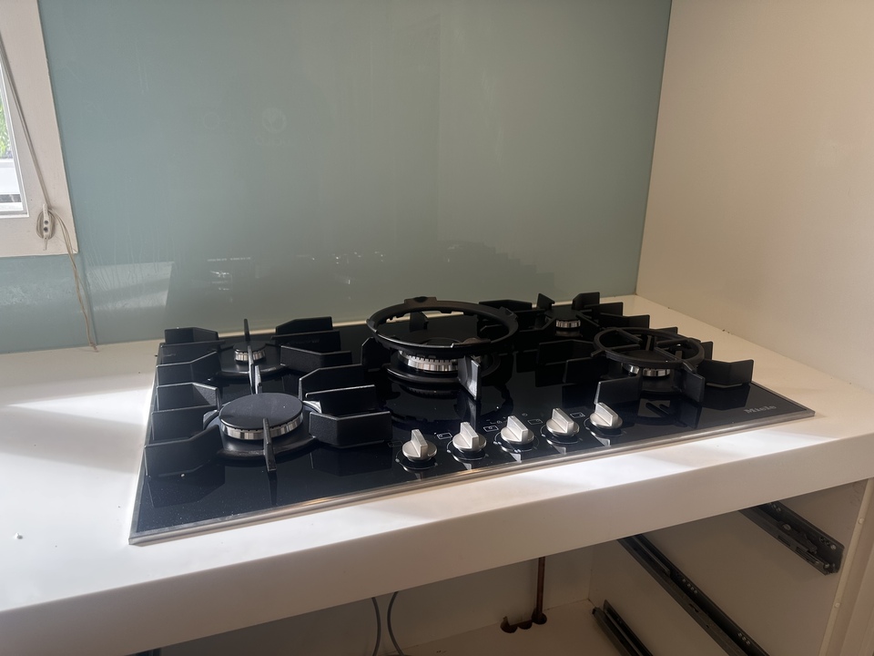 Gas hob during installation showing underneath the bench
