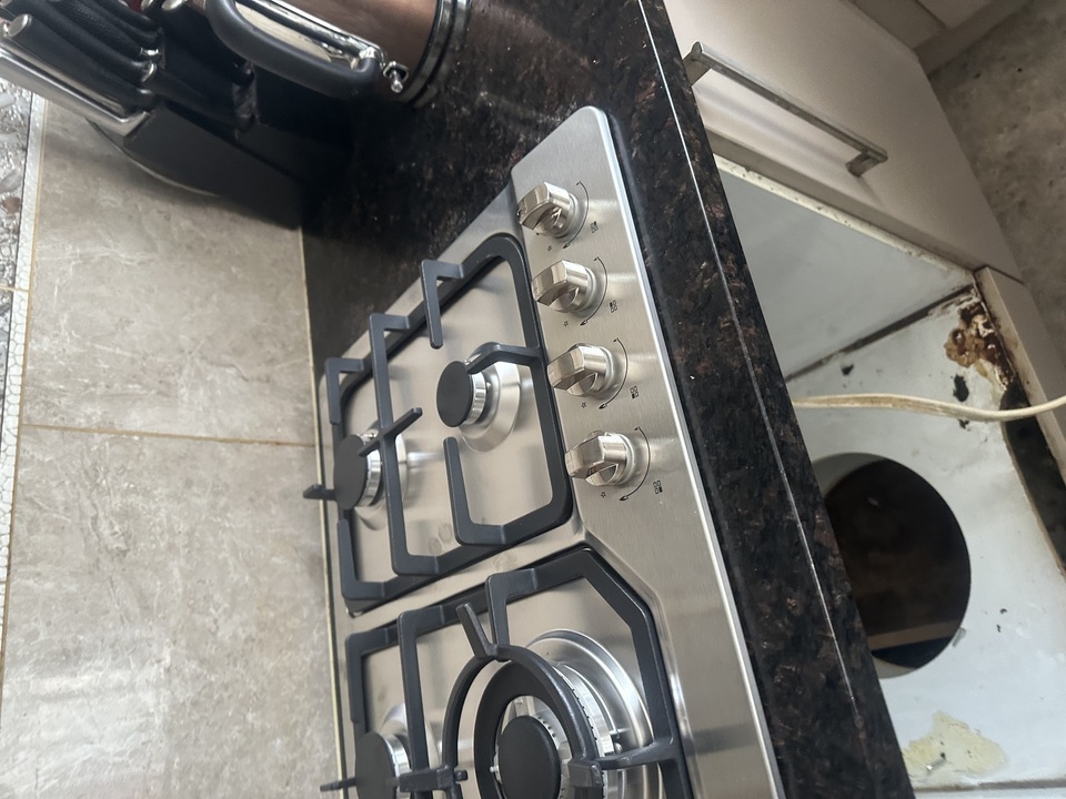Gas hob during installation showing underneath the bench