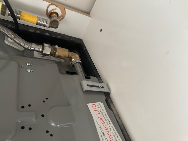 The underneath cupboard under gas hob