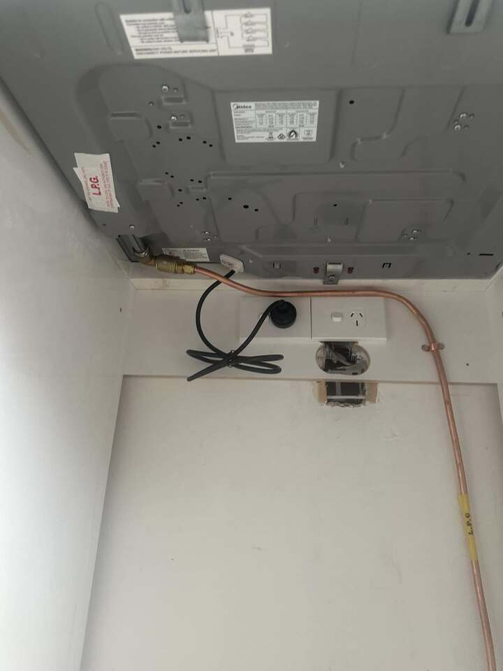 Gas flue on top of house on roof