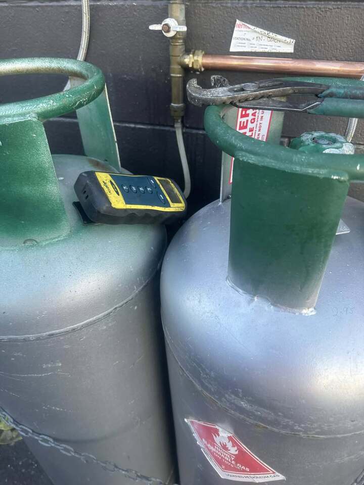 Gas flue on top of house on roof