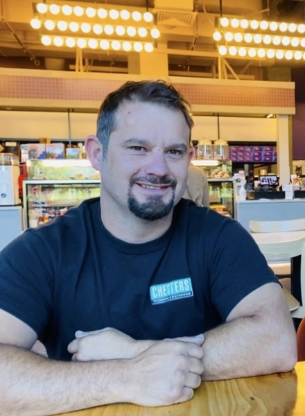 Jason Sammut at home with his dogs