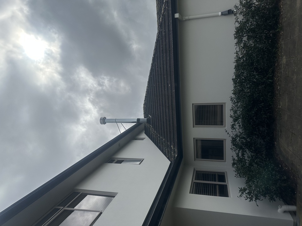 Gas flue on top of house on roof