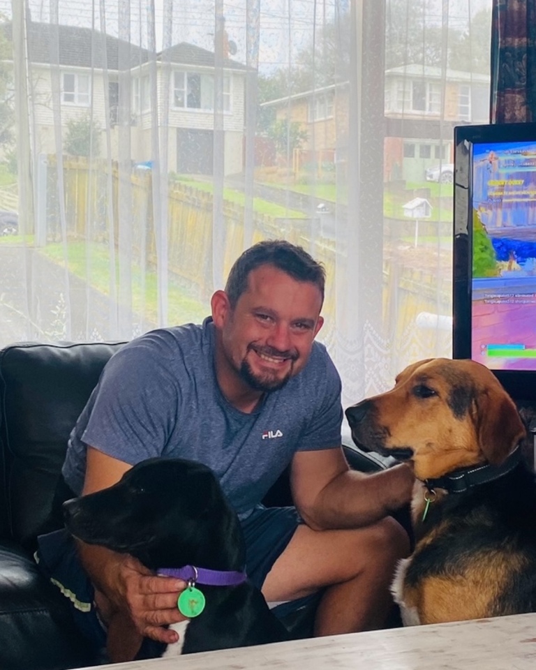 Jason Sammut at home with his dogs 